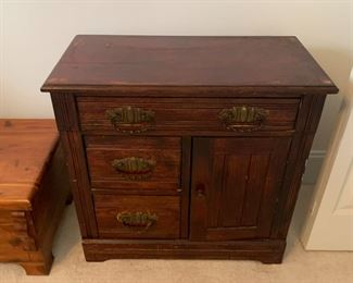 #118	3 drawer 1 door antique chest with or without  marble top 30x15x29	 $120.00 			
photo without the marble top  