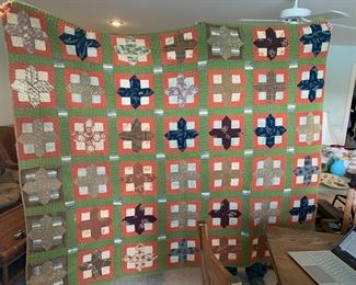 #144	Machine pieced hand quilted square piece quilt as is a few holes  82x68	 $30.00 			
