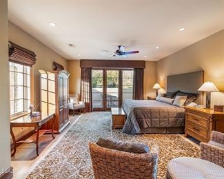 casita furnishing includes a custom king size bed, lamps, an armoire, a gorgeous room size rug, and a library table.