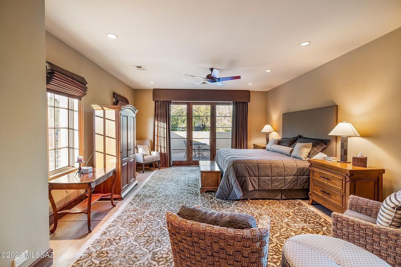 casita furnishing includes a custom king size bed, lamps, an armoire, a gorgeous room size rug, and a library table.