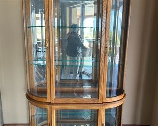 Oak curved glass curio cabinet with lights. $300