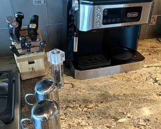Like new DeLongi coffee pot/esprsso maker.  Henckel and Zwilling cutlery.