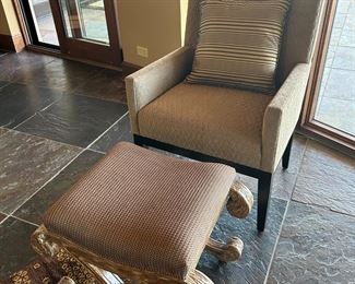 One of two matching chairs and ottomans, sold separately.