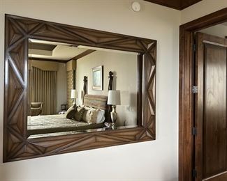 Very large, very heavy, very beautiful beveled glass mirror.  Master bedroom set is reflected.