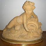 A VERY LARGE ROGERS ERA POTTERY FIGURE OF A PUTTI.