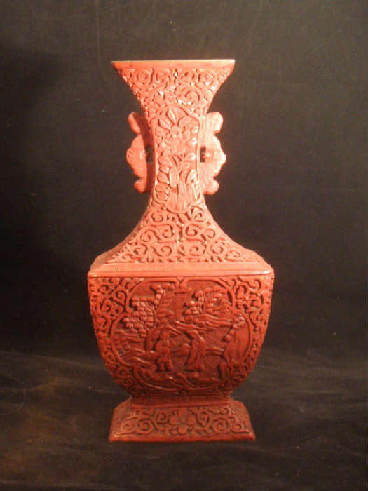 CHINESE CINNABAR VASE WITH STYLIZED DRAGON LUGS, LATE 19TH CENTURY.