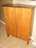 ANTIQUE NATUICAL FLAG CABINET WITH BRASS LATCH. MANY FLAGS.