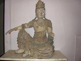 CHINESE 19TH CENTURY GUAN YIN IN "AT ROYAL EASE POSTURE" POLYCHROME CARVED WOOD.OLD PAINT, SURFACE DAMAGE. 29" X 32"
