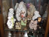 A COLLECTION OF POTTERY & PORCELAIN MONKEYS.