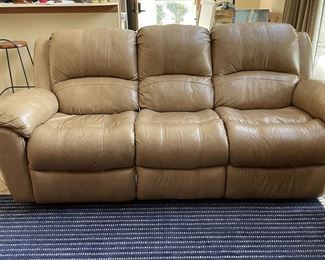 Leather couch has two electric recliners