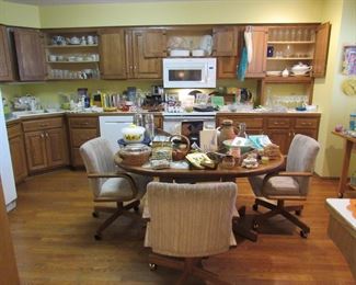 Lots of kitchen wares, table with rolling chairs