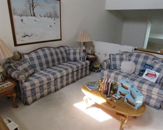 Comfortable matching sofa and loveseat, matching coffee and end tables, large Winter theme painting