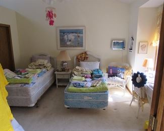 White wicker bedroom set, twin size bed linens, lots of beach theme