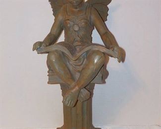 Sweet Angel Reading on A Column