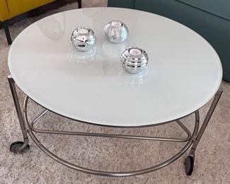 Glass top rolling coffee table