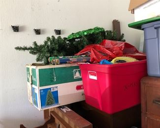 Assorted Christmas decorations and artificial trees
