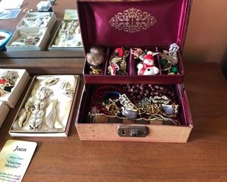 Assorted costume jewelry and box