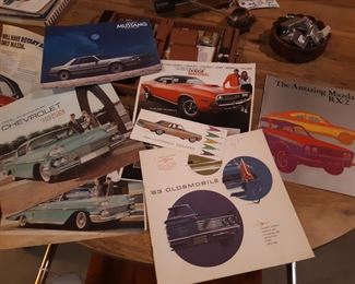 Vintage automobile ads and manuals, basement