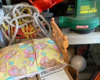 Old doll bed and yard equipment 