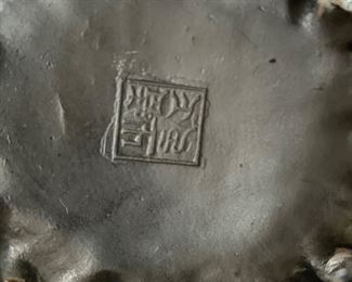 Stamp on bottom of Asian figurine~