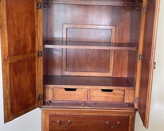 View of inside of armoire~