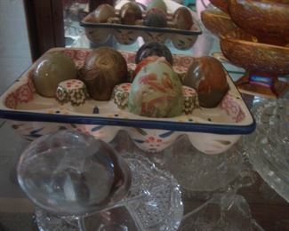 Marble eggs in pottery egg plate