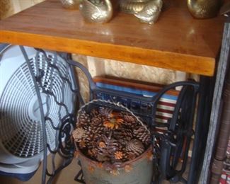 Table w iron sewing machine base, old bucket w pine cones