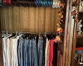 More ladies clothes in bedroom. Slacks and jeans in basement