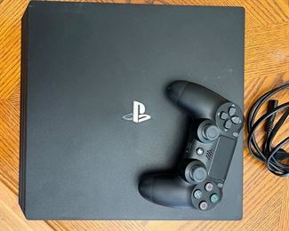 PS4 with controller and wires