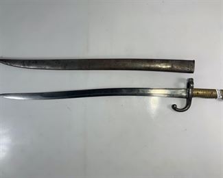 Mid to Late 19th Century French Beaumont Rifle Bayonet - In Original Steel Scabbard - Inscribed With French Phrase and Dated 1868 - Blade Has A Few Knicks But In Overall Great Condition - Blade Is 22 1/2 Inches Long
