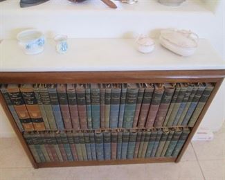 Vintage Leather-Bound Book Collection with Bookcase
