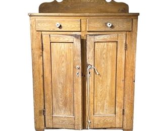 19TH C. GRAIN PAINTED CUPBOARD | 19th century Mustard Grain painted cupboard with two drawers over double cabinet doors before three shelves
Turnip feet. Probably PA . -  l. 42.5 x w. 18.5 x h. 62 in
