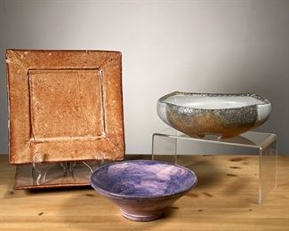 (4PC) MEG SMEAL POTTERY GROUP | By Meg Smeal and other Potters Including a pair of square round glazed plates a textured bowl and a purple pedestal bowl. - h. 3 x dia. 8 in (larger bowl)
