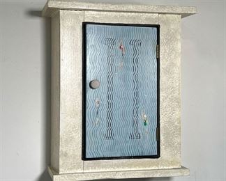FOLK ART HANGING CUPBOARD WITH SPONGE PAINT | Folk Art Hanging wall cupboard of small size with sponge design cream paint. Door in blue with swimmers in lanes. -  l. 16.75 x w. 7.25 x h. 19 in 