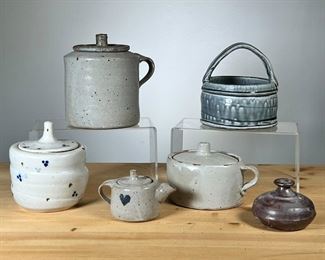 (6PC) MEG SMEAL ART POTTERY JARS & TEAPOTS | Of small size, including little jars, a small tea pot with heart, and an open basket with handle.
By Meg Smeal and other potters. - h. 4.5 x dia. 5 in (largest)