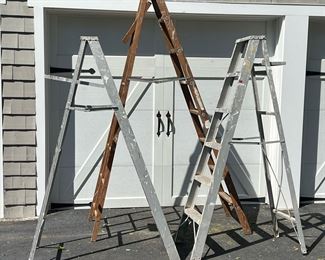 (3PC) LOT OF LADDERS | Two 6-foot aluminum painters ladders and one 8-foot wood ladder.