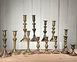 (13PC) BRASS CANDLESTICKS | (13) Brass candlesticks  (3) Pairs, (7) are singles. - h. 10 in (Tallest)