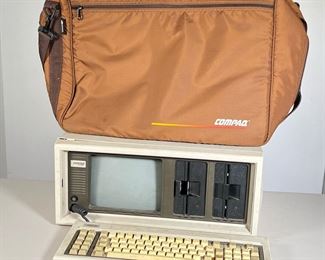 VINTAGE "LUGGABLE" COMPAQ COMPUTER | Compaq Portable Computer from the 1980's W/Carry Case.  Tested- Screen does light up, Not tested if working as New Floppy Disc is needed.  Sold as is. - l. 19 x w. 8 x h. 16 in (Closed in Case) 