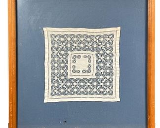 FRAMED DOILY | Doily on blue matt framed behind glass. - l. 15.5 x w. 16 in (overall)