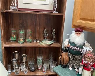 Baccarat and Waterford glass golfers, framed lithograph, an acrylic golf ball ice bucket; pewter and glassware, holiday golfers, and more