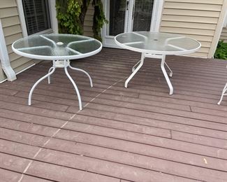 white glass topped tables (48" round and 36" round)