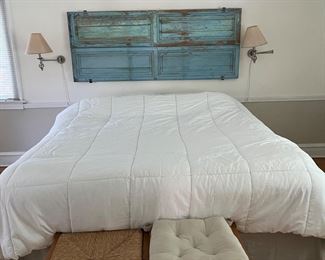 vintage blue shutters stacked and hung as a headboard