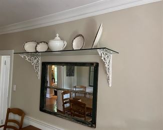 cast iron brackets under glass shelf 