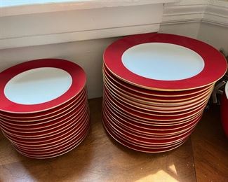 stacks of Crate & Barrel red rimmed holiday plates