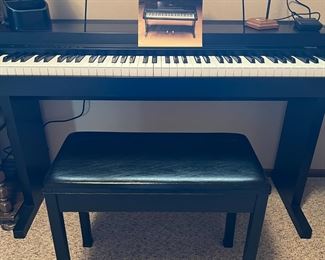 Mint condition, Clavinova with bench, also sheet music