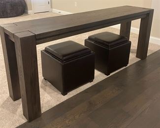 Restoration Hardware reclaimed wood parson’s sofa table; Crate & Barrel leather storage cubes 