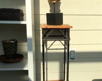 Metal bamboo stand with statue 
