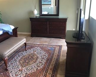 Upper level bedroom Broyhill Dresser and mirror.  Media stand and tv.  Area rug.  Bed settee.