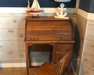 Vintage child’s roll top desk and swivel chair.  Charming!