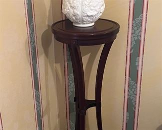 Beautiful white vase with great detail.  There is a slight crack in it that is not visible if you spin the vase around.  It is still a lovely display piece.
